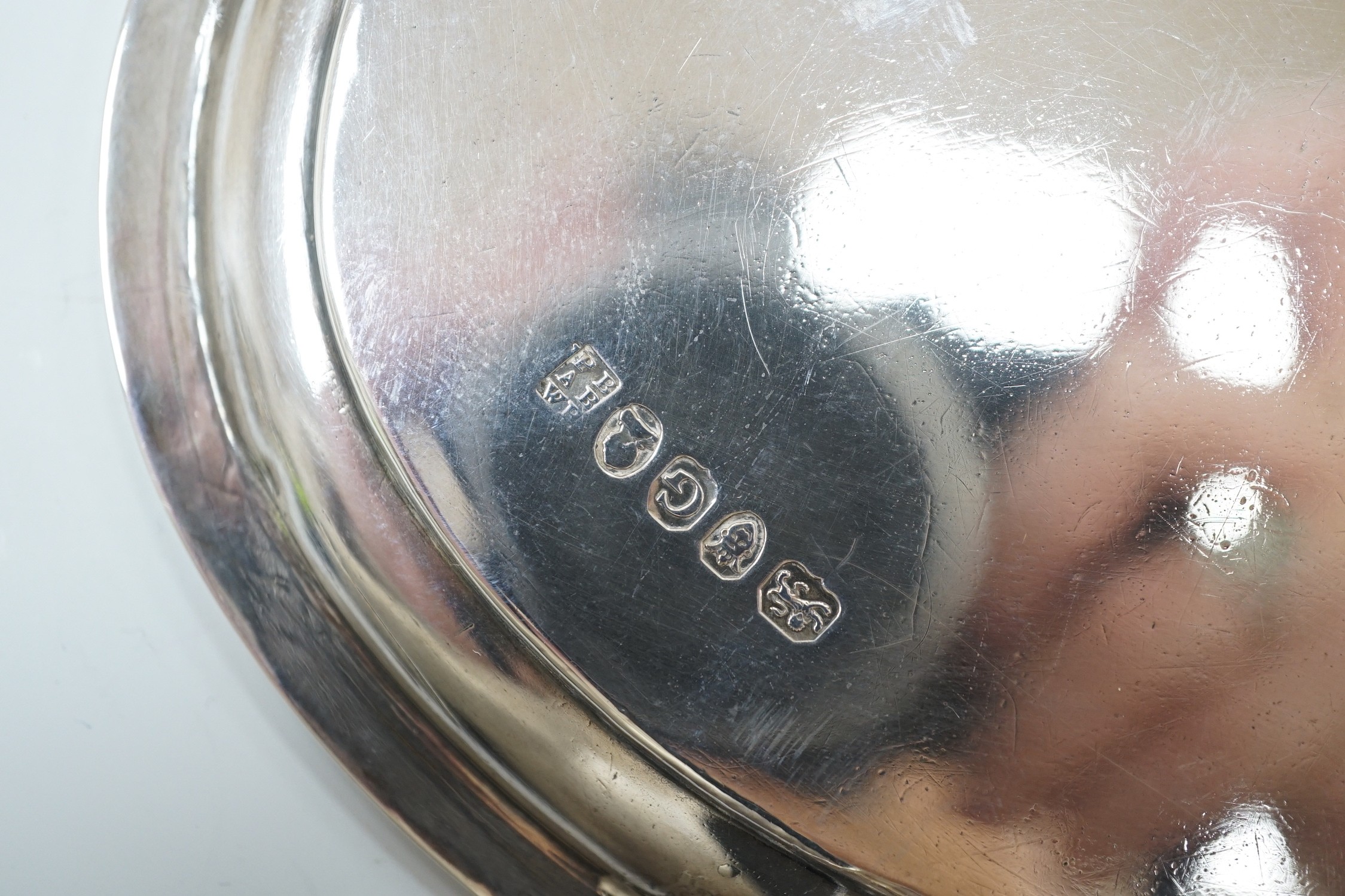 A George III silver oval teapot stand, by Peter, Ann & William Bateman, London, 1802, 18cm, 4.8oz, with reeded border, on four reeded feet.